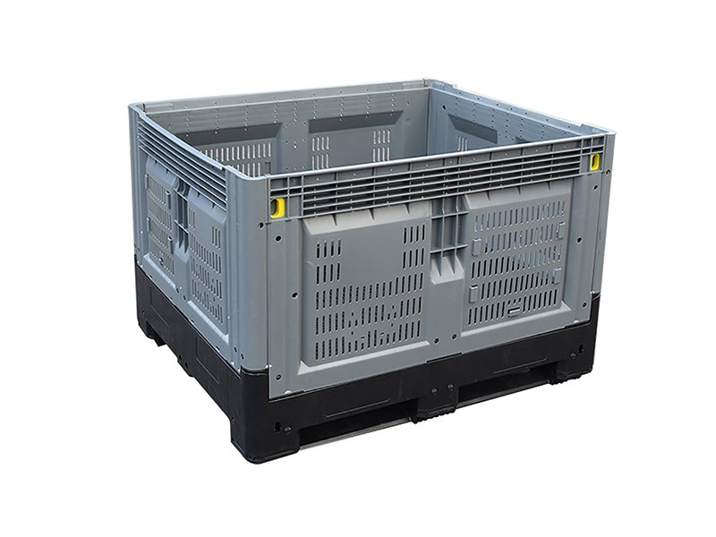 A grey vented plastic pallet box, showcasing its ventilated structure with perforations on the sides.