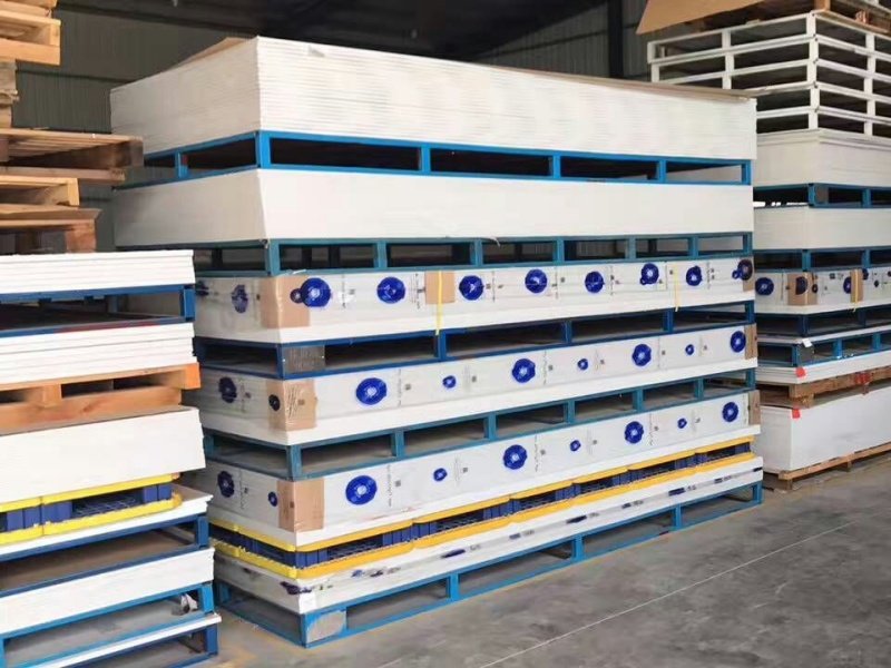 White panels on blue splicing modular plastic pallets, furniture mfg.