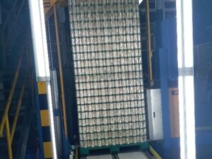 Beer plastic pallets on an automatic conveyor line.