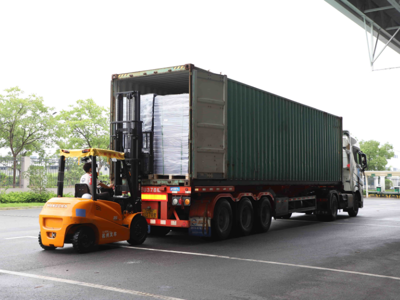 plastic pallet collars being loaded for shipment