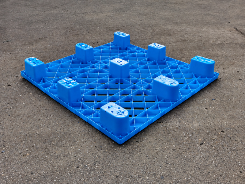 the base of 1200 × 1000 × 140 mm nestable plastic pallet in factory