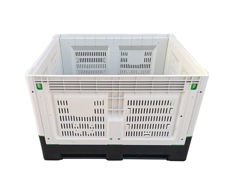 Ventilated collapsible plastic pallet crate with perforated sides for fresh produce and agricultural storage.