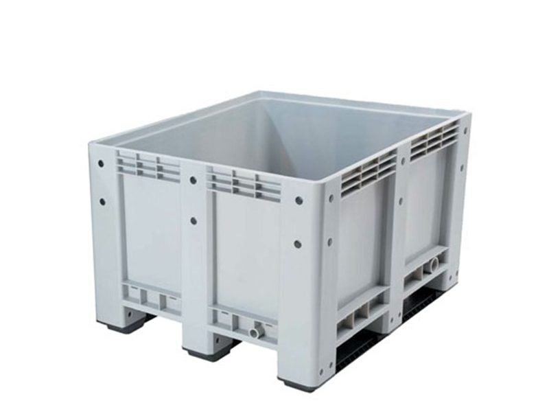 A solid plastic pallet box, presented from a frontal view, highlighting its sturdy design and utility for storage and transport.